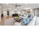 Spacious living room open to the modern kitchen, featuring an island with bar seating at 700 Park Regency Ne Pl # 1605, Atlanta, GA 30326