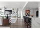 Living room with views to kitchen with island seating, built-in shelves and fireplace at 700 Park Regency Ne Pl # 1605, Atlanta, GA 30326