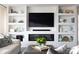 Built-in shelving and fireplace in living room provide ample storage and cozy ambiance at 700 Park Regency Ne Pl # 1605, Atlanta, GA 30326