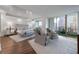 Large, bright bedroom with hardwood floors, a crystal chandelier, and city views at 700 Park Regency Ne Pl # 1605, Atlanta, GA 30326