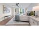 Bright, open bedroom with balcony access, a ceiling fan, and neutral decor at 700 Park Regency Ne Pl # 1605, Atlanta, GA 30326