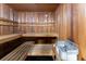Relaxing wooden sauna with benches and heater, ideal for unwinding and promoting wellness at 700 Park Regency Ne Pl # 1605, Atlanta, GA 30326