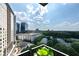 Stunning cityscape view featuring modern high-rise buildings surrounded by mature trees at 700 Park Regency Ne Pl # 1605, Atlanta, GA 30326