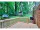 Wooden deck overlooking a large backyard with a storage shed in a private, wooded setting at 2802 Leisure Woods Ln, Decatur, GA 30034