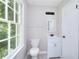 Bathroom featuring a large window, toilet and vanity at 2802 Leisure Woods Ln, Decatur, GA 30034
