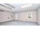 Spacious garage with concrete floors, neutral paint, and a window to let in natural light at 2802 Leisure Woods Ln, Decatur, GA 30034