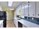 Well-lit kitchen featuring stainless steel appliances, white cabinets, and modern countertops at 2802 Leisure Woods Ln, Decatur, GA 30034