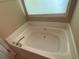 Large soaking tub with jets, perfect for relaxing after a long day at 413 W Wind Dr, Villa Rica, GA 30180