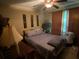 Comfortable bedroom with a queen-size bed, soft lighting, and ample natural light at 413 W Wind Dr, Villa Rica, GA 30180