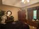 Spacious bedroom featuring a tray ceiling, dark wood furniture, and a relaxing atmosphere at 413 W Wind Dr, Villa Rica, GA 30180