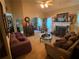 Cozy living room featuring a fireplace, comfortable seating, and a bright, airy ambiance at 413 W Wind Dr, Villa Rica, GA 30180