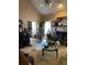 Spacious living room with a vaulted ceiling, fireplace, and comfortable seating area at 413 W Wind Dr, Villa Rica, GA 30180