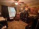 Home office setup with a desk, chair, and storage shelving for an efficient workspace at 413 W Wind Dr, Villa Rica, GA 30180