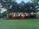 Inviting backyard with string lights, a brick paver staircase, and lush landscaping for outdoor entertaining at 881 Park Manor Nw Ct, Marietta, GA 30064