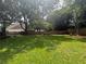 Lush backyard featuring a well-kept lawn and wooden privacy fence with mature trees and landscaping at 881 Park Manor Nw Ct, Marietta, GA 30064