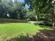 Large, well-maintained backyard with a lush green lawn and privacy fence, perfect for outdoor activities at 881 Park Manor Nw Ct, Marietta, GA 30064
