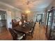 Formal dining room with classic wood flooring, wainscoting, and an ornate chandelier at 881 Park Manor Nw Ct, Marietta, GA 30064