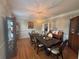 Elegant dining room featuring detailed crown molding, a large dining table, and hardwood floors for entertaining guests at 881 Park Manor Nw Ct, Marietta, GA 30064