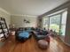 Cozy living room featuring a bay window with natural light and a comfortable sectional sofa at 881 Park Manor Nw Ct, Marietta, GA 30064