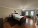 Spacious bedroom with hardwood floors, ceiling fan, and lots of natural light at 881 Park Manor Nw Ct, Marietta, GA 30064