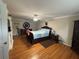 Inviting bedroom with hardwood floors, neutral colors, and classic decor at 881 Park Manor Nw Ct, Marietta, GA 30064