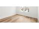 Bright bedroom featuring light wood flooring and a double window view at 490 Hammons Way, Atlanta, GA 30315