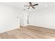 Bright and airy bedroom showcasing hardwood floors, ceiling fan, and walk-in closet at 490 Hammons Way, Atlanta, GA 30315