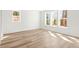 Sunlit bedroom with ample windows and light wood flooring, creating a bright and airy space at 490 Hammons Way, Atlanta, GA 30315