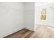 Walk in closet with wire shelving and light wood floors with large window at 490 Hammons Way, Atlanta, GA 30315