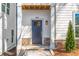 Welcoming front entrance with stone accents and a stylish black door with modern hardware at 490 Hammons Way, Atlanta, GA 30315