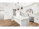 Bright kitchen island with stainless steel appliances and white cabinets at 490 Hammons Way, Atlanta, GA 30315