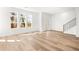 Bright and spacious living area showcasing hardwood floors and large windows at 490 Hammons Way, Atlanta, GA 30315