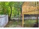 A partial view of the backyard with a deck and a white fence at 85 Ollie St, Atlanta, GA 30314