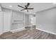 Grey bedroom with a ceiling fan, two windows, new floors, and a closet, creating a comfortable retreat at 85 Ollie St, Atlanta, GA 30314
