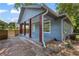 A wide angle view of the exterior with red porch posts at 85 Ollie St, Atlanta, GA 30314