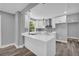 Modern kitchen with white cabinetry, stainless steel appliances, and hardwood flooring at 85 Ollie St, Atlanta, GA 30314