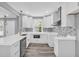 Beautiful kitchen features white cabinets, modern appliances, and subway tile backsplash at 85 Ollie St, Atlanta, GA 30314