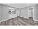 View of the living room, showcasing the open layout to the updated kitchen and bathroom at 85 Ollie St, Atlanta, GA 30314