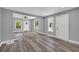 Open-concept living room featuring hardwood floors, recessed lighting, and multiple windows at 85 Ollie St, Atlanta, GA 30314