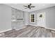 Living room boasts a modern fireplace, ceiling fan, hardwood floors and exterior door at 85 Ollie St, Atlanta, GA 30314