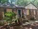 Small, one-story brick home with boarded windows and a small porch at 2904 Glenwood Se Ave, Atlanta, GA 30317