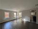 Bright living room with hardwood floors and ample natural light from multiple windows at 2904 Glenwood Se Ave, Atlanta, GA 30317