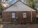 Exterior side view of brick home with windows and utility connections visible at 2904 Glenwood Se Ave, Atlanta, GA 30317