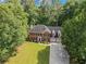 Aerial view of a brick two-story home with a well-manicured lawn at 4961 Thornwood Nw Trce, Acworth, GA 30102