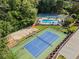 Aerial view of community pool, tennis courts, and sand volleyball court at 4961 Thornwood Nw Trce, Acworth, GA 30102