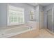 Bright bathroom with large tub and separate glass door shower at 4961 Thornwood Nw Trce, Acworth, GA 30102