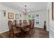 Formal dining room with chandelier, wainscoting and natural light at 4961 Thornwood Nw Trce, Acworth, GA 30102