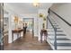 Inviting foyer featuring hardwood floors, staircase with painted trim and decorative accents at 4961 Thornwood Nw Trce, Acworth, GA 30102