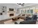 Bright living room with fireplace, built-in bookshelves, and large windows at 4961 Thornwood Nw Trce, Acworth, GA 30102