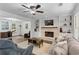 Cozy living room with fireplace, built-ins, and comfortable seating area at 4961 Thornwood Nw Trce, Acworth, GA 30102